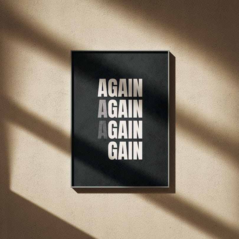 A black and white poster hanging on a wall A black and white poster hanging on a wall