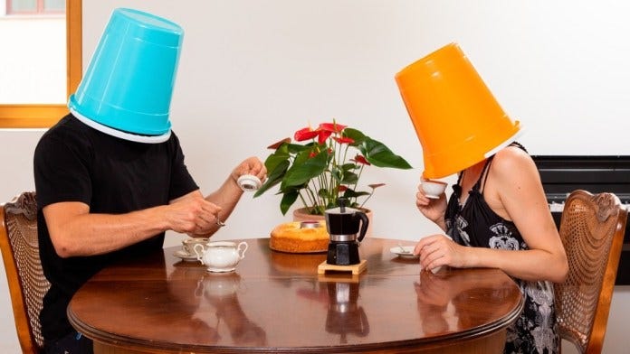 Young,Loving,Couple,Drinks,Coffee,In,The,Dining,Room,With