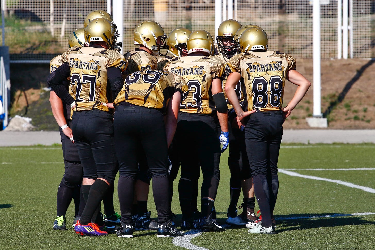 Football team huddle Football team huddle