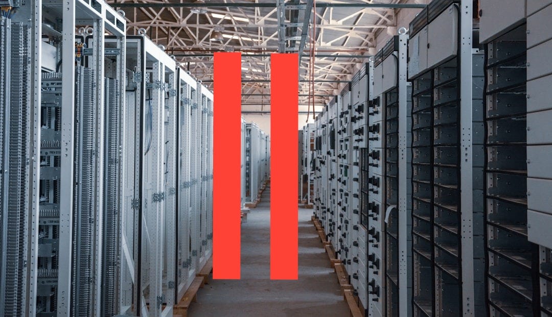 server room aisle with metal equipment racks server room aisle with metal equipment racks