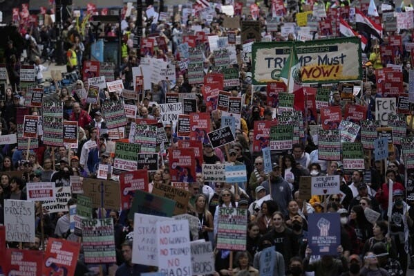 People march during Illinois Coalition for Immigrant & Refugee Rights' "Chicago Says No Trump No Troops" protest Saturday, Sept. 6, 2025, in Chicago. (AP Photo/Carolyn Kaster)