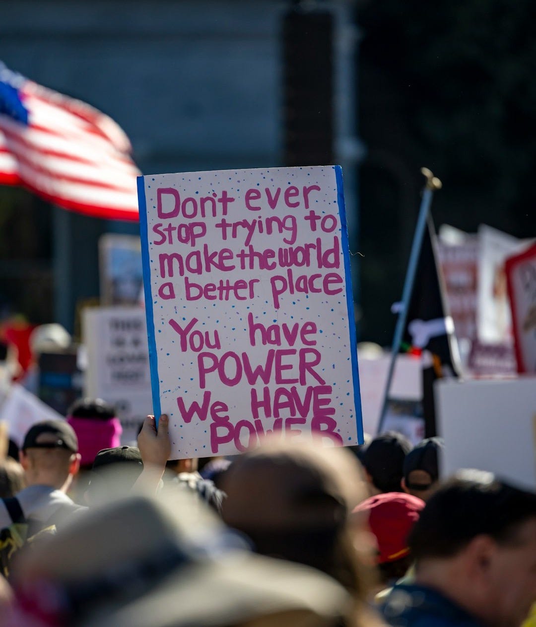 Protest sign reads "you have power we have power"