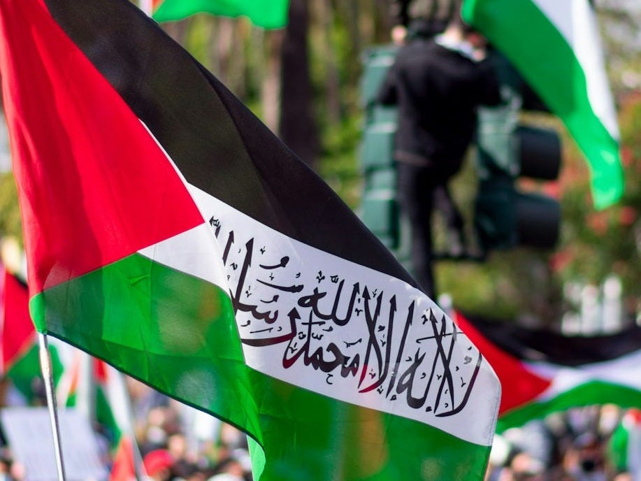 people holding flags during daytime people holding flags during daytime