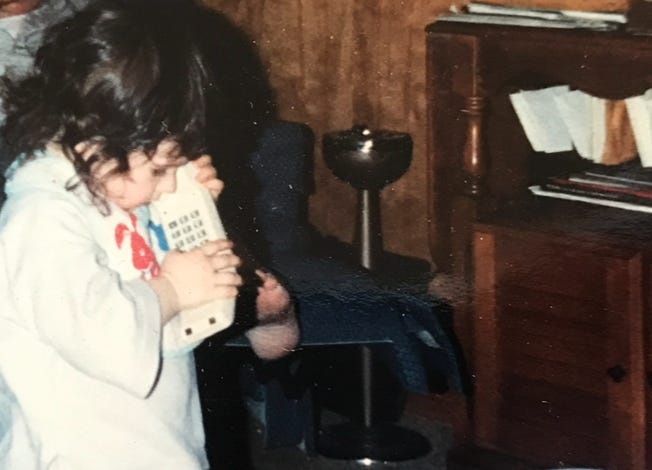 Baby Lyric is obsessed with the buttons on the phone. Baby Lyric is obsessed with the buttons on the phone.
