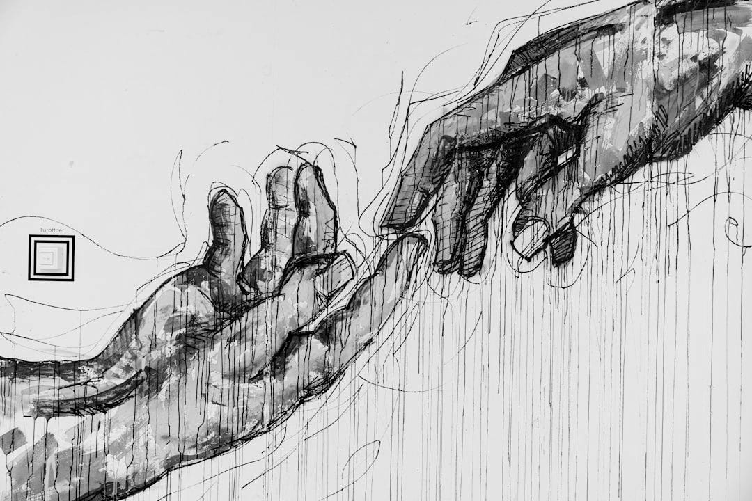 two human hands painting