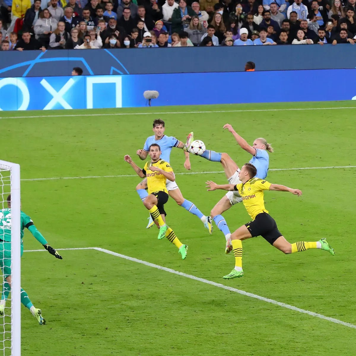 Just a man scoring a goal with his foot when the ball is about 7 feet off the ground, against some of the world’ best defenders. Just a man scoring a goal with his foot when the ball is about 7 feet off the ground, against some of the world’ best defenders.