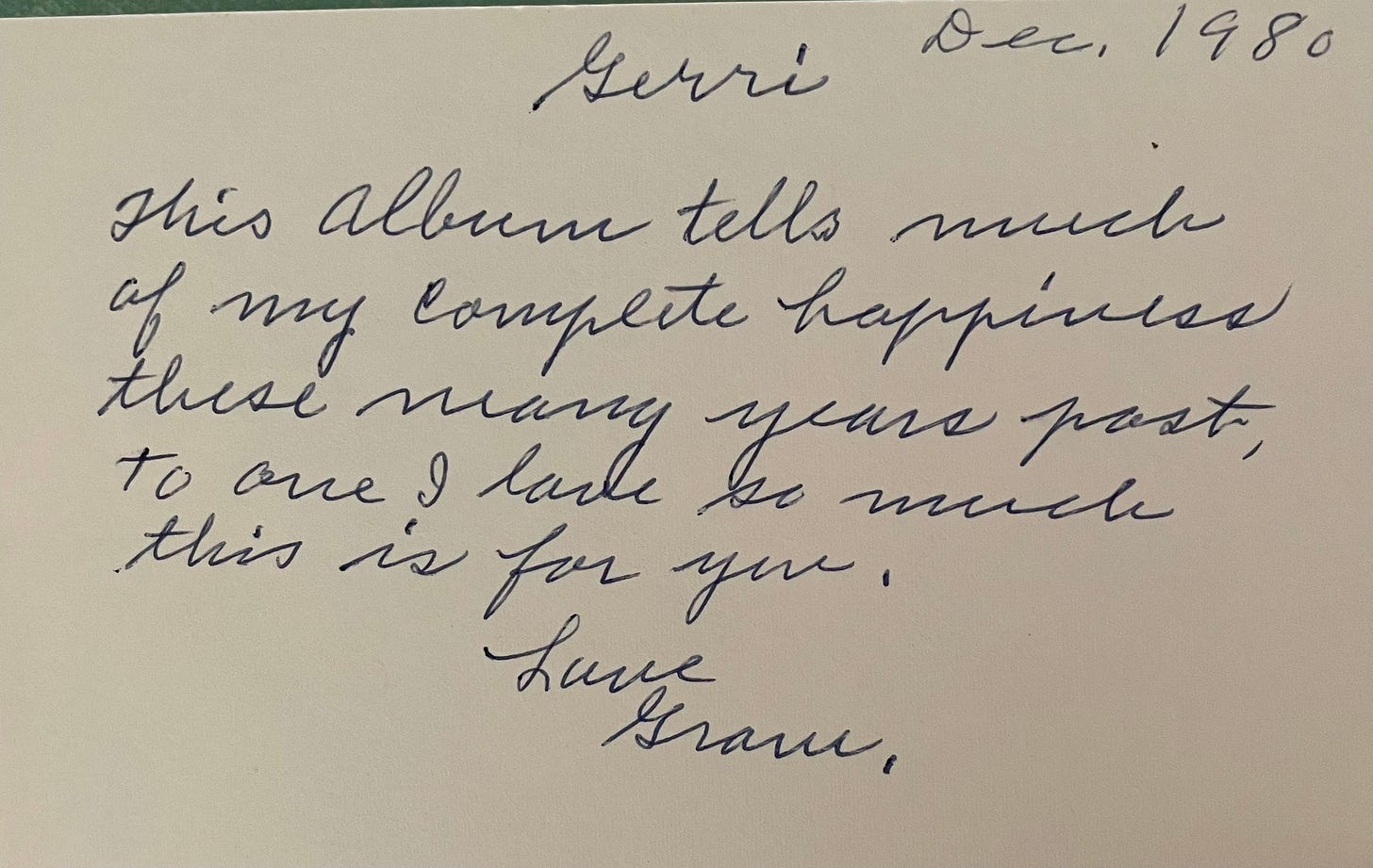 Detail of a handwritten inscription on a photo album.