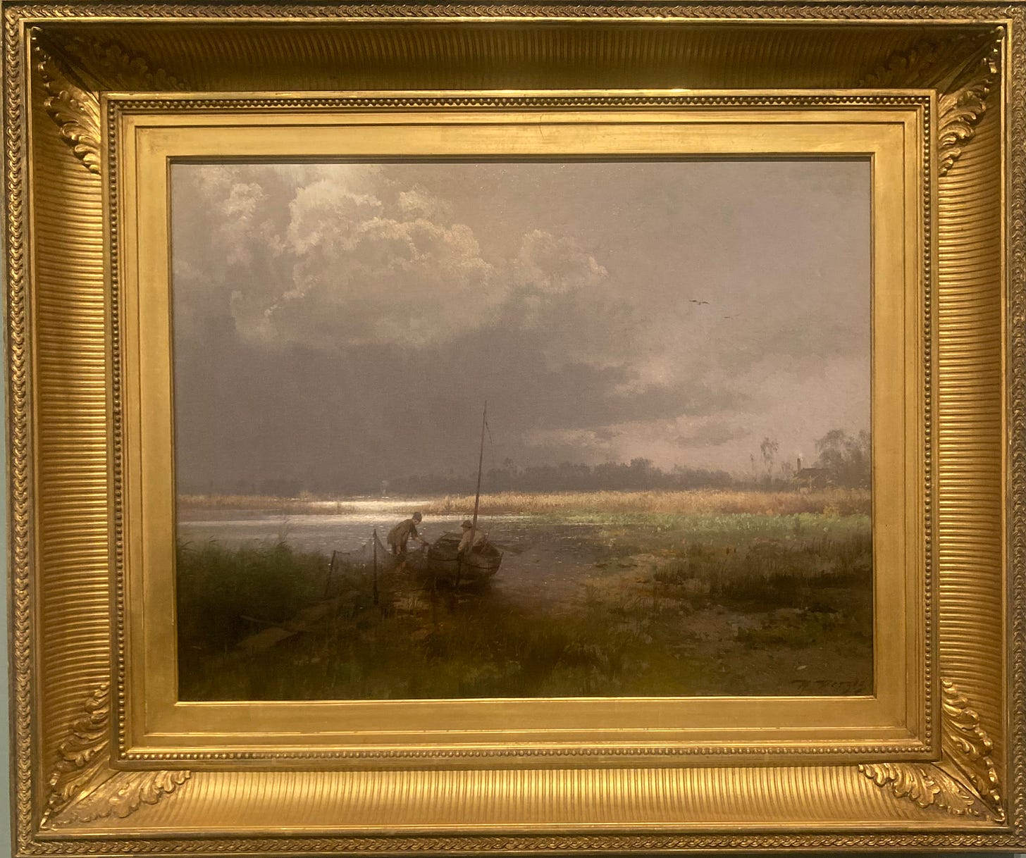 An oil painting of two people launching a small boat into a lake. The colors and the light are muted. The frame is gold. 