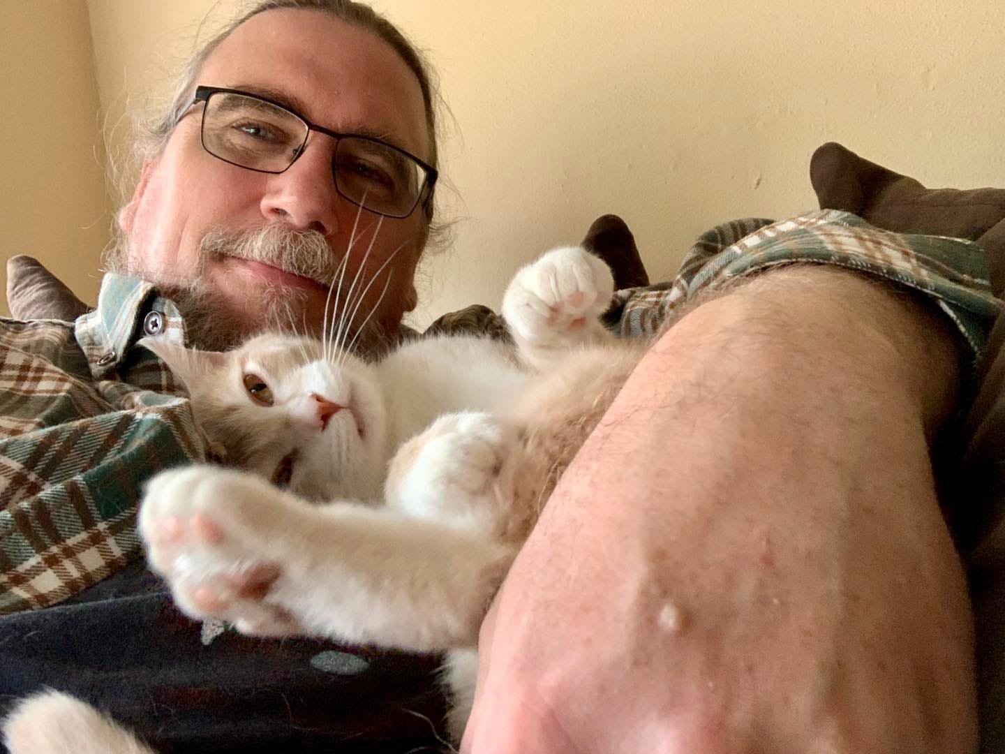 May be an image of 1 person and cat