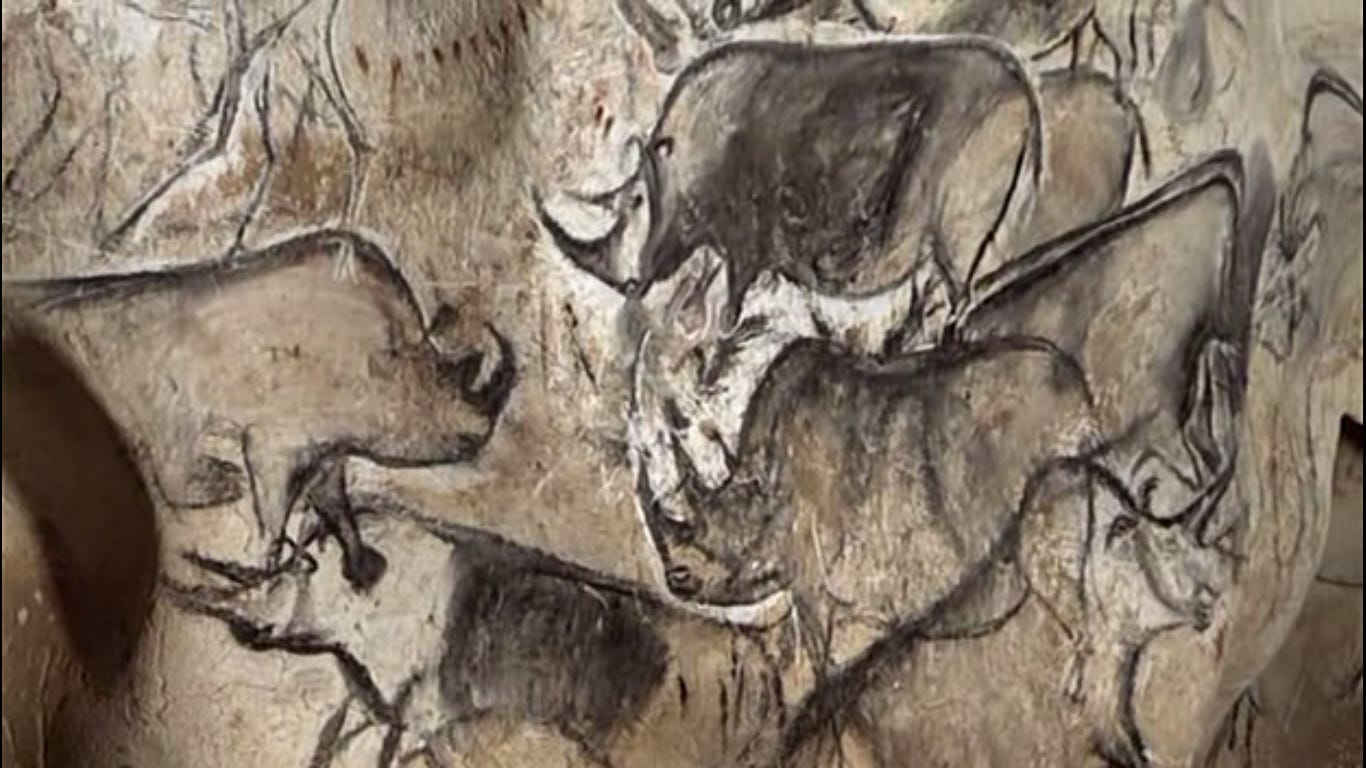 A close-up of a cave painting with Chauvet Cave in the background

AI-generated content may be incorrect.