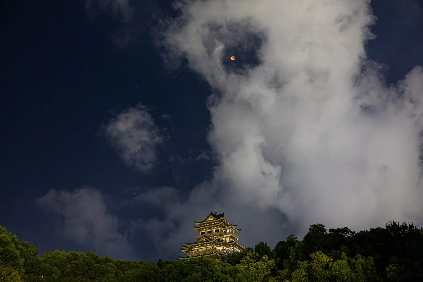 The “blood moon” is seen in the skies over Wenling, Zhejiang province, China. Photo: Xinhua
