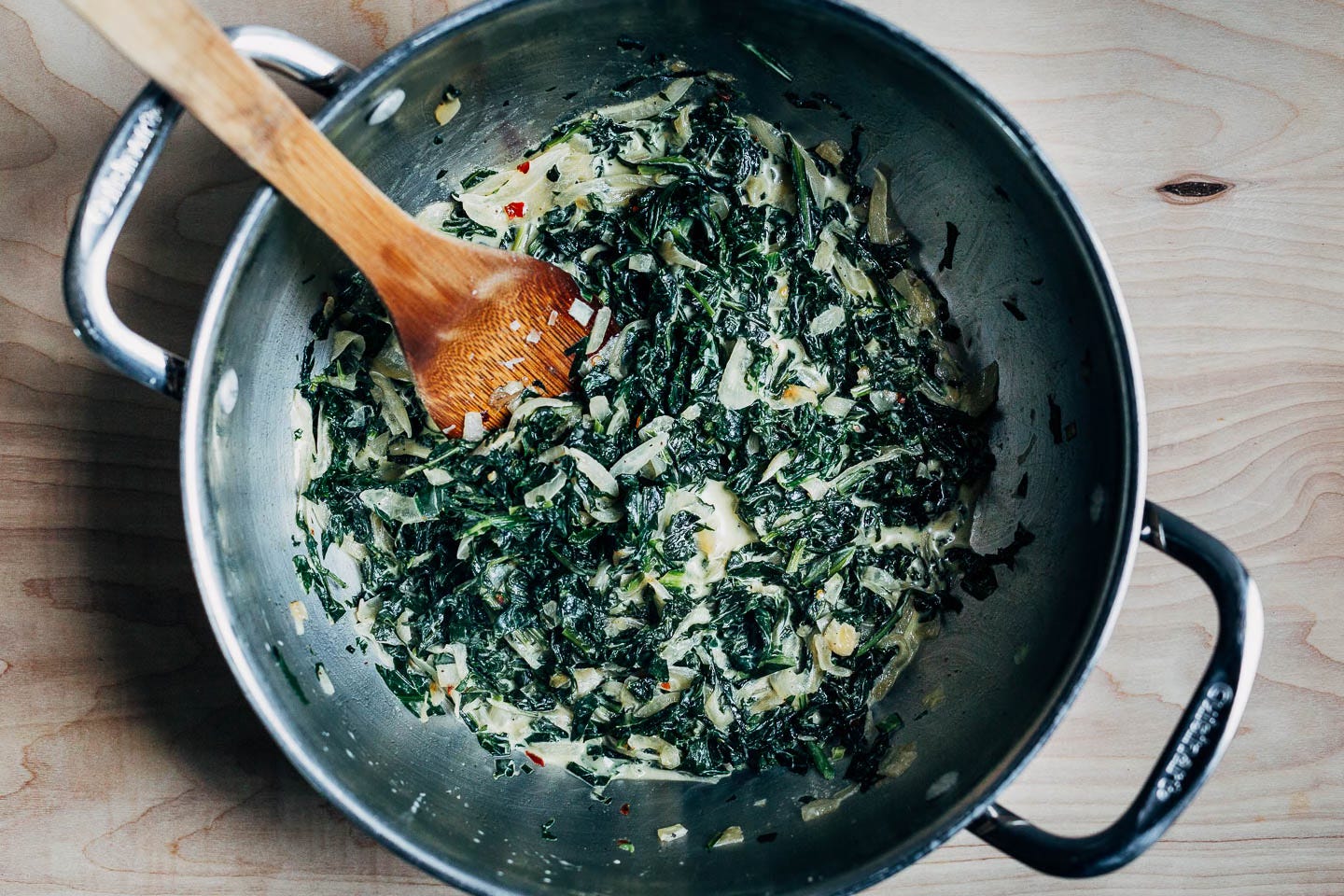 Creamed greens in a pot.