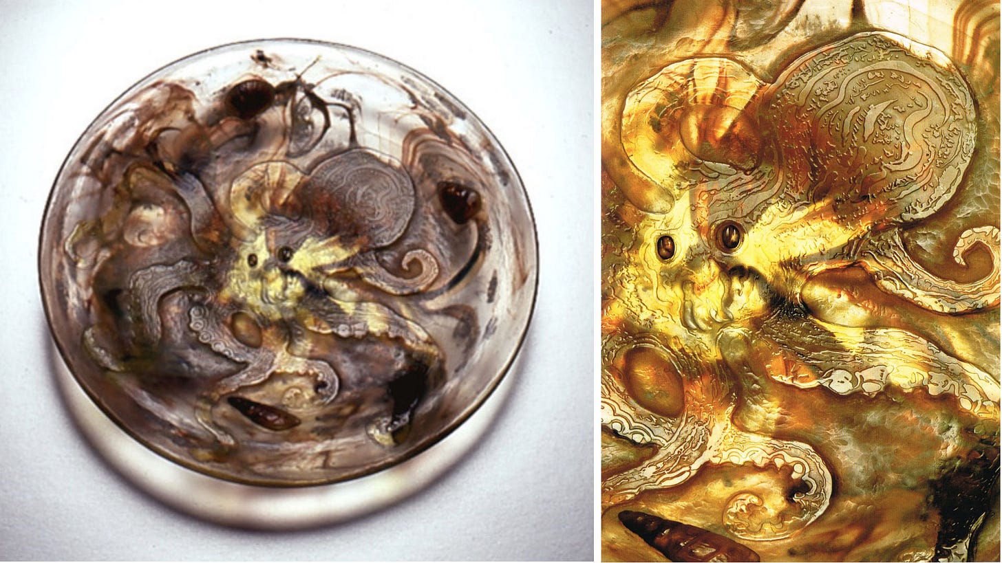 Émile Gallé, Plate with octopus, ca. 1902-1904, 4.7 x 27.7 cm, Kunstpalast Düsseldorf, mkp.LP 2009-59, gift of Gerda Kœpff (© Kunstpalast, Düsseldorf Ausstellung). Details of the applied eyes of the octopus and shells. Émile Gallé, Plate with octopus, ca. 1902-1904, 4.7 x 27.7 cm, Kunstpalast Düsseldorf, mkp.LP 2009-59, gift of Gerda Kœpff (© Kunstpalast, Düsseldorf Ausstellung). Details of the applied eyes of the octopus and shells.