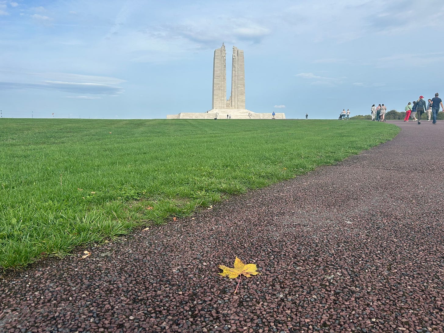May be an image of 6 people, Stone Henge and grass