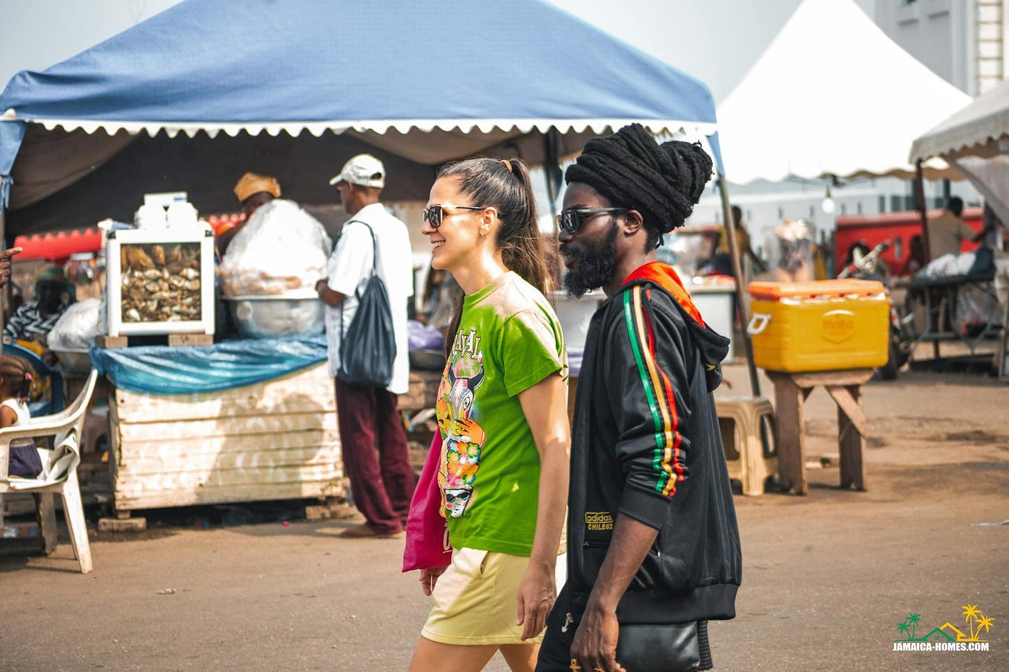 young couple walking on a street market