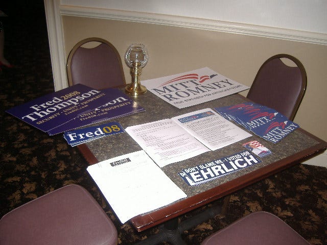 Fred Thompson and Mitt Romney items shared space on this table. Fred Thompson and Mitt Romney items shared space on this table.