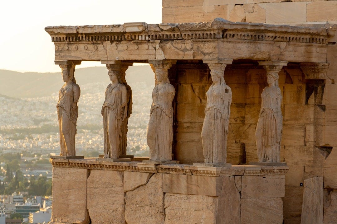 a group of statues on the side of a building