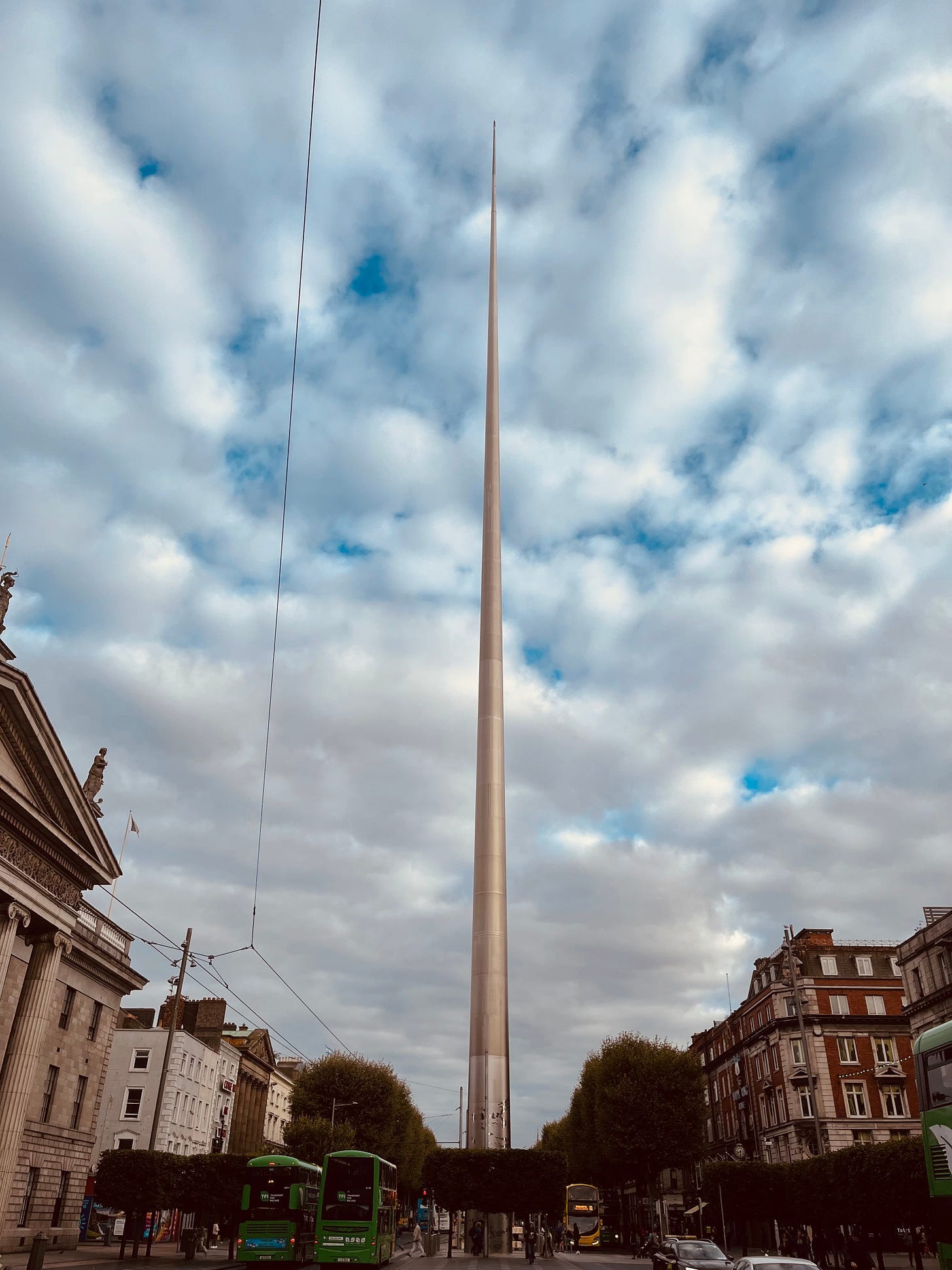 A tall tower in a city

Description automatically generated