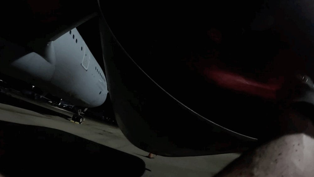 Screengrab shows a pro-Palestine activist approaching an RAF aircraft during the sabotage operation. (Palestine Action) Screengrab shows a pro-Palestine activist approaching an RAF aircraft during the sabotage operation. (Palestine Action)