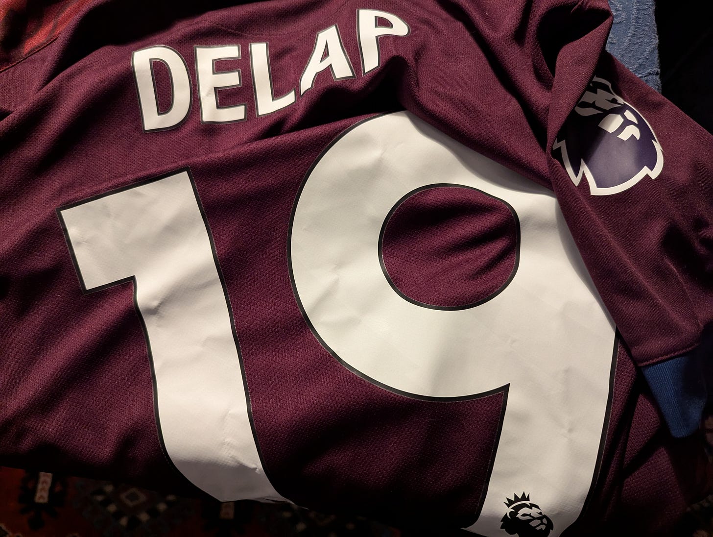 Burgundy Ipswich away shirt with Delap 19 printed on the back