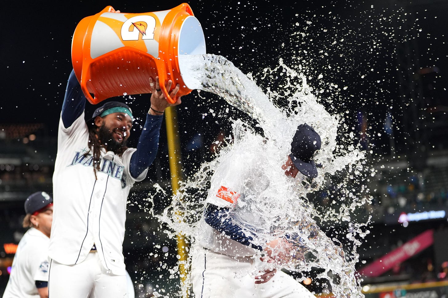 Mariners’ Colt Emerson, right, is doused by teammate J.P. Crawford, left, as they celebrate a win over the White Sox after a baseball game, Monday, in Seattle. Mariners’ Colt Emerson, right, is doused by teammate J.P. Crawford, left, as they celebrate a win over the White Sox after a baseball game, Monday, in Seattle.
