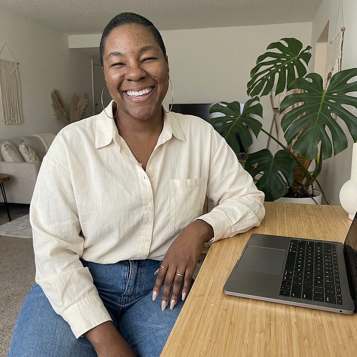 Kahdija Imari poses for a photo during her first podcast and post production business venture "Squrrl Studios." Kahdija Imari's AI twin poses in a home office space.