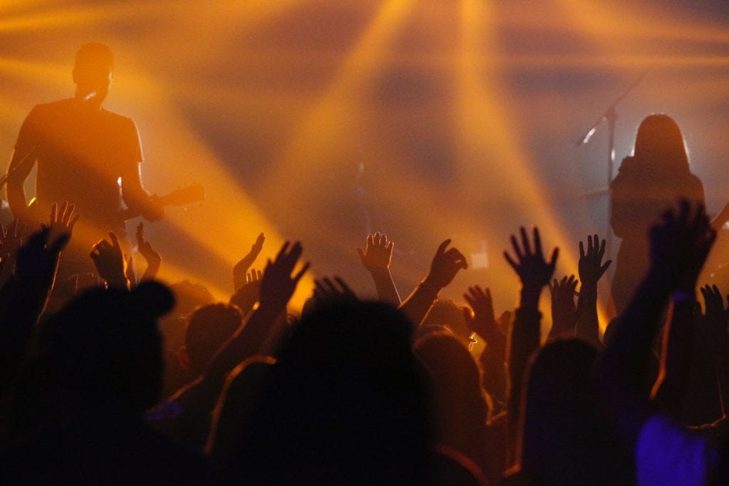 Rock concert, like a business or personal brand and its followers, fans, buyers feed off each other's brand messaging, in a blog by Joanne Tan, 10PlusBrand.com