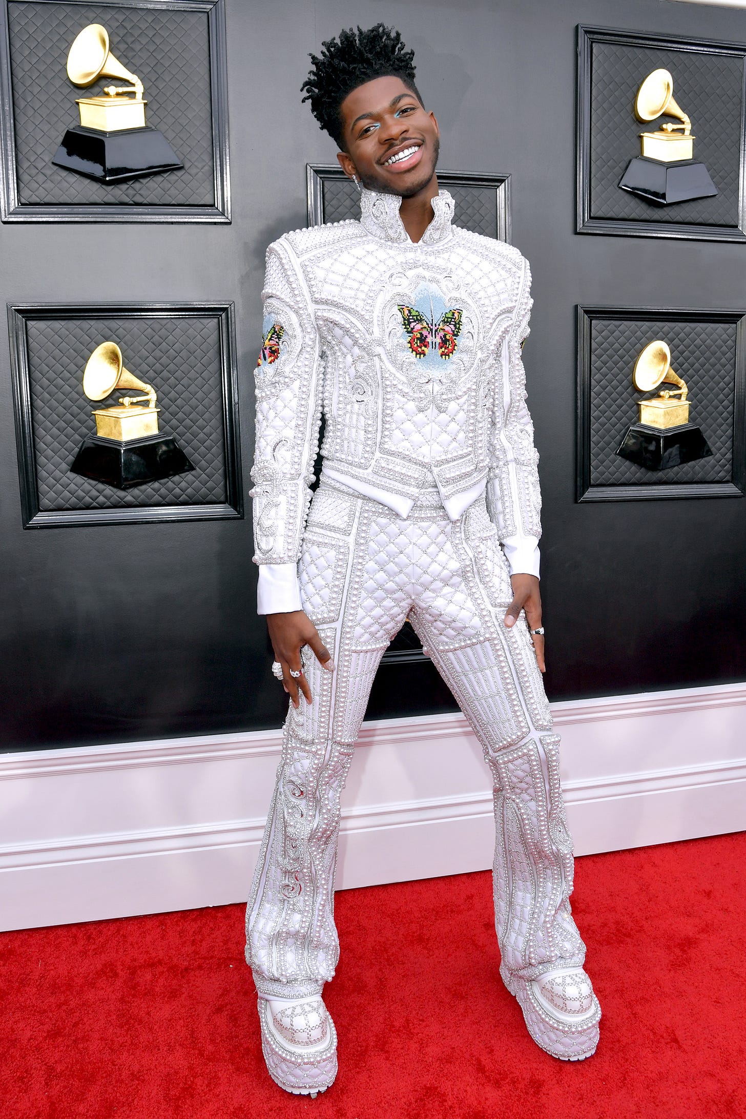 Lil Nas X suits up in pearls on the Grammys 2022 red carpet