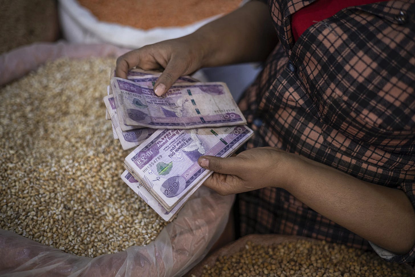 A vendor counts out Ethiopian birr banknotes in Addis Ababa.