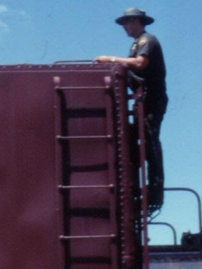 A US Border Patrol Agent checks a railcar that crossed into the country from Mexico for contraband. A US Border Patrol Agent checks a railcar that crossed into the country from Mexico for contraband.