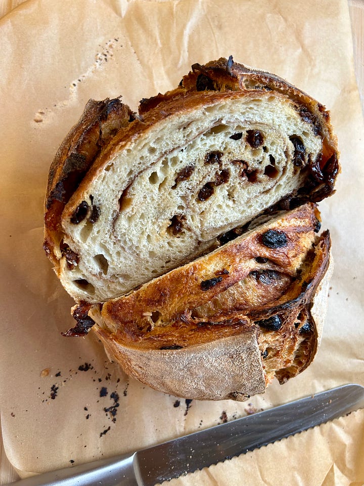 Collage of sourdough loaves, featuring an overhead shot and crumb shot of a cinnamon raisin loaf and a cranberry, white chocolate, and orange sourdough loaf.