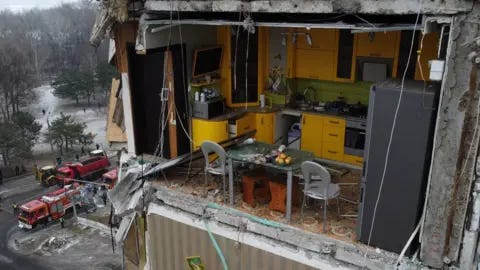 Yan Dobronosov The yellow kitchen seen with its wall blown off