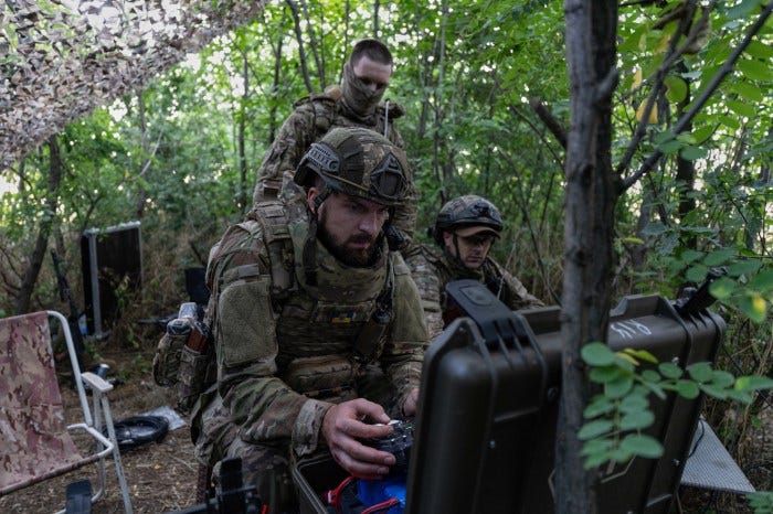 A Ukrainian servicemember operating a drone near the front-line in eastern Ukraine. A Ukrainian servicemember operating a drone near the front-line in eastern Ukraine.