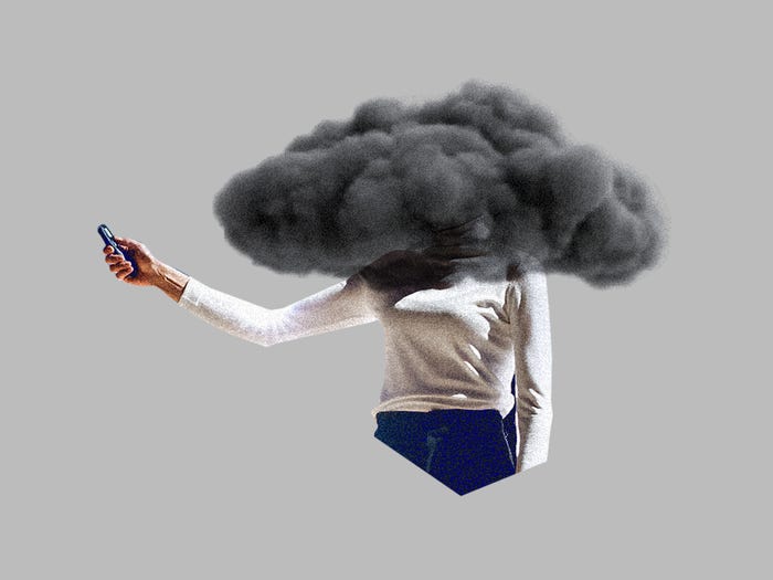 A founder with her face in a storm cloud