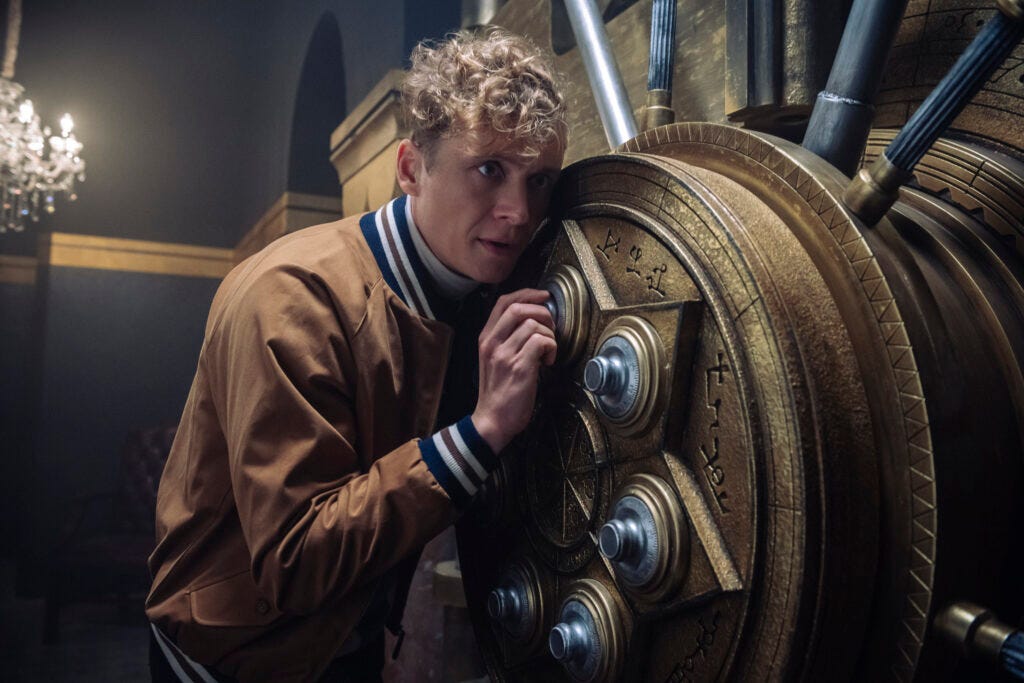 army of thieves film graphic shows unreasonably large vault with amazeballs number of tumbler sets