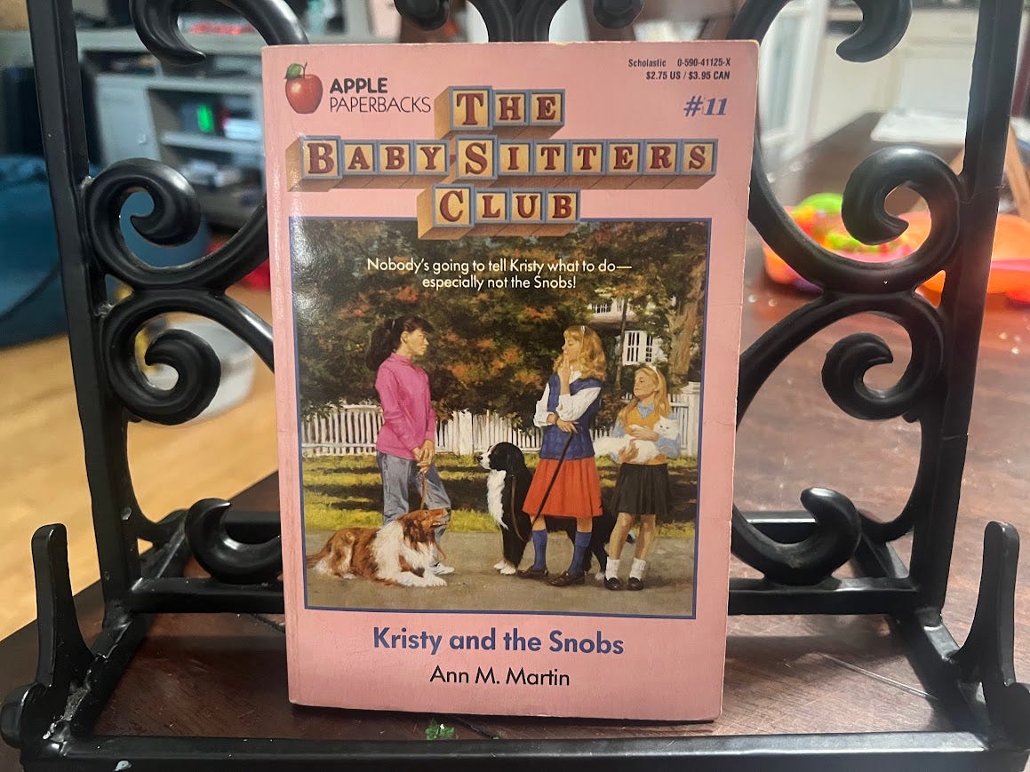 Photo of The Baby Sitters Club book #11 with the title "Kristy and the Snobs." 