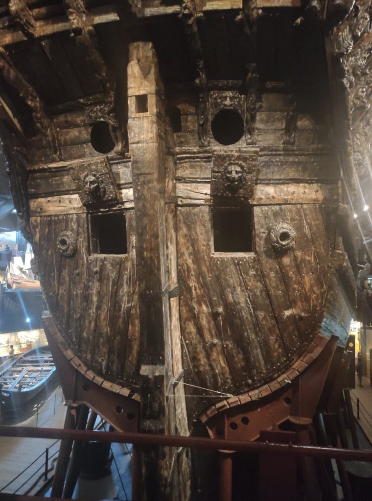 Rear view of the ship, with gun ports open and preserved dark wood