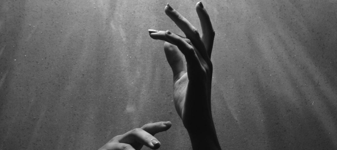 person raising both hands