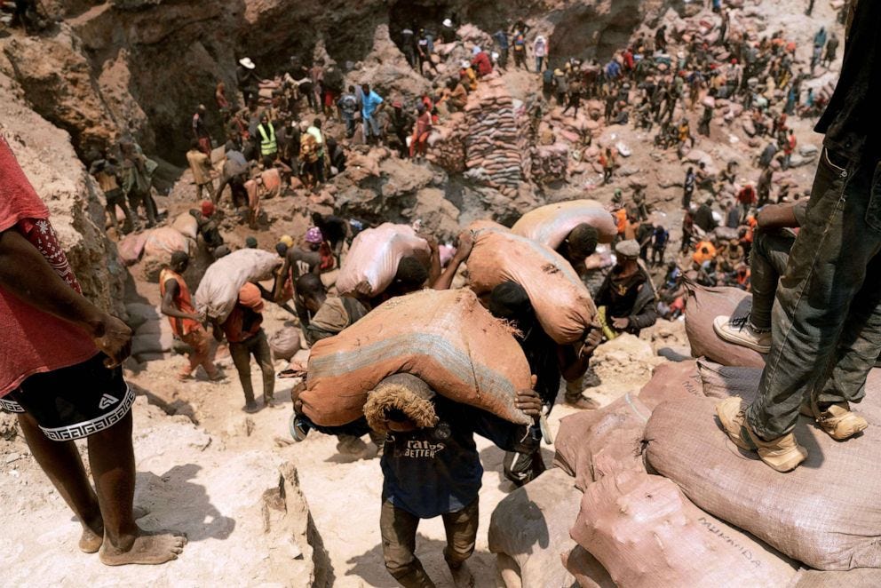PHOTO: Artisanal miners carry sacks of ore at the Shabara artisanal mine near Kolwezi, Democratic Republic of Congo, Oct. 12, 2022. PHOTO: Artisanal miners carry sacks of ore at the Shabara artisanal mine near Kolwezi, Democratic Republic of Congo, Oct. 12, 2022.