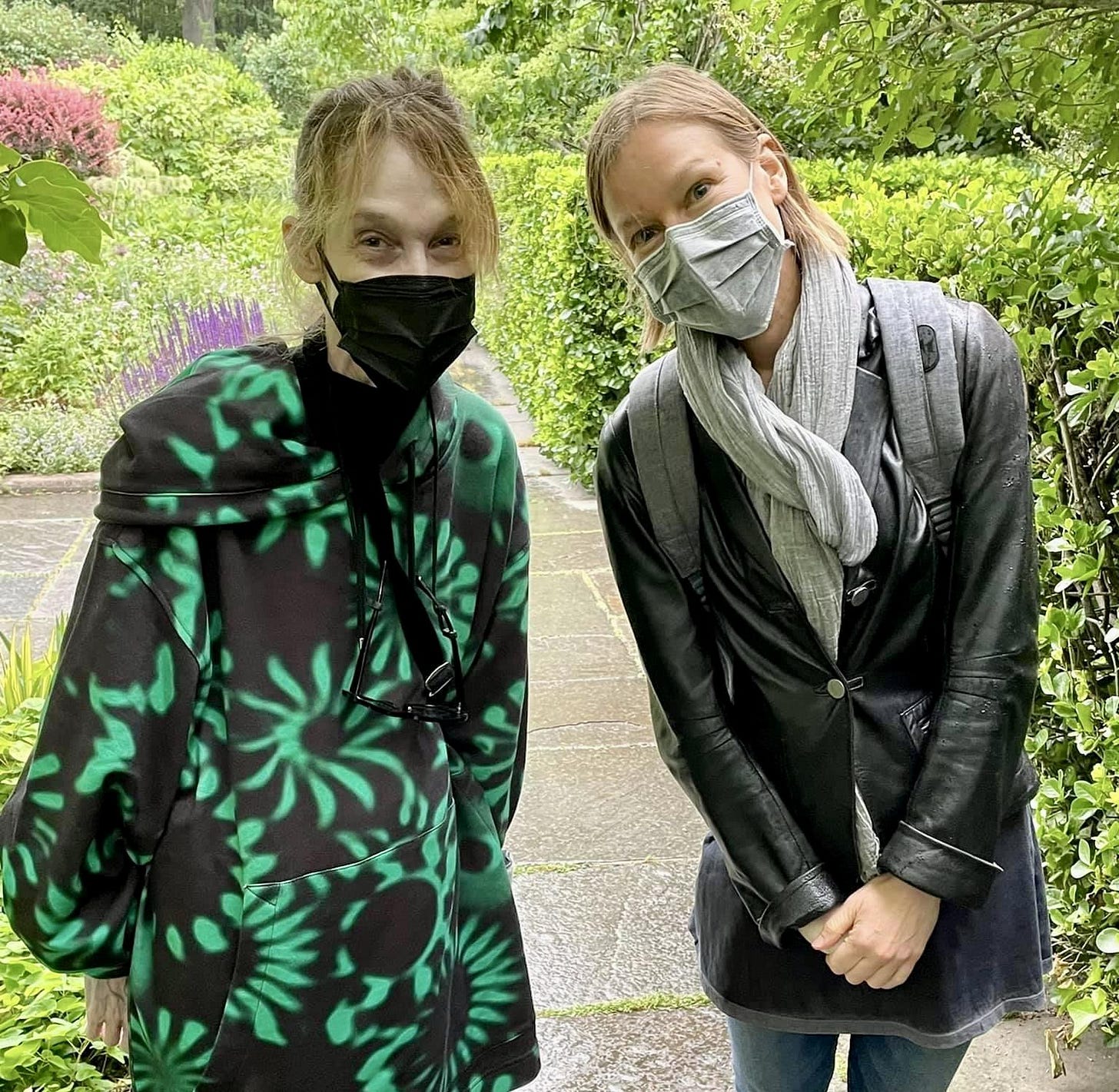 Two women, Robin on the left, Claire on the right, facing the camera, wearing masks (and smiles). Central Park is the backdrop with mostly green foliage, and a footpath stretching behind them. Two women, Robin on the left, Claire on the right, facing the camera, wearing masks (and smiles). Central Park is the backdrop with mostly green foliage, and a footpath stretching behind them.