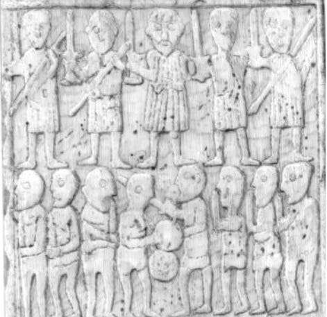 Detail of the carving on the reverse (‘battle’) face of Sueno’s Stone, showing a warband of five warriors, first facing the viewer, then engaged in combat with an enemy. Detail of the carving on the reverse (‘battle’) face of Sueno’s Stone, showing a warband of five warriors, first facing the viewer, then engaged in combat with an enemy.