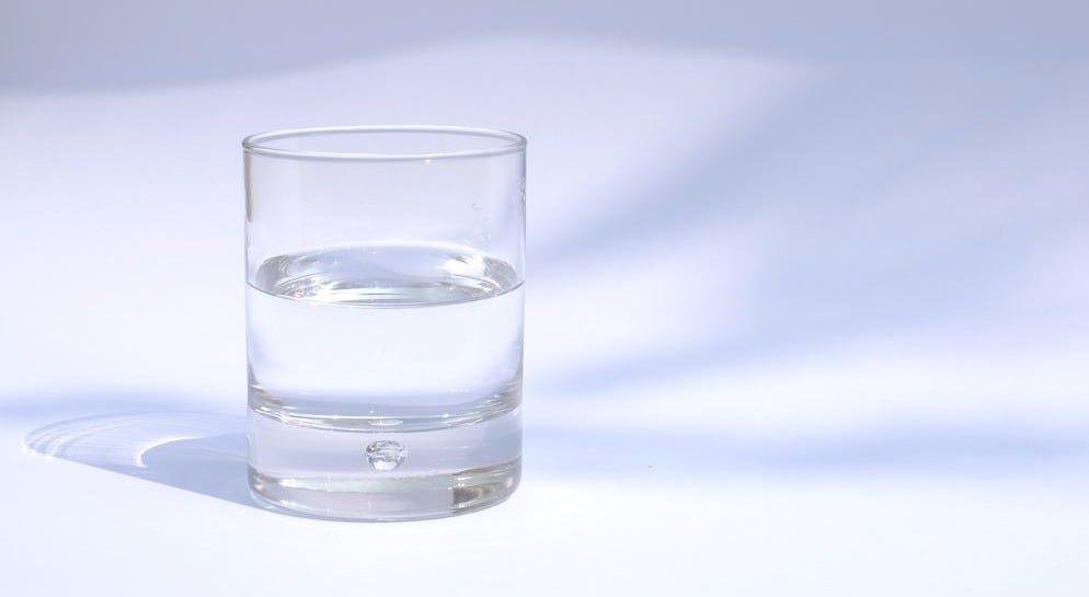 clear drinking glass filled with water