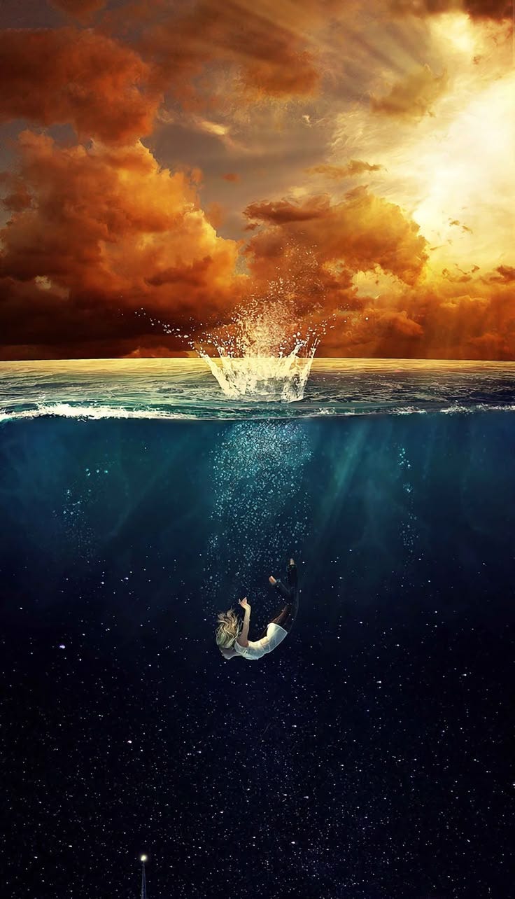 This may contain: a man is swimming in the ocean under an orange and blue sky with clouds above him