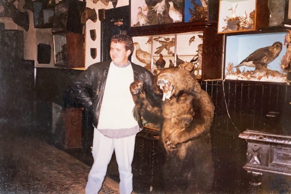 Author as young man makes many pints disappear. Poses for picture with bear. Author as young man makes many pints disappear. Poses for picture with bear.