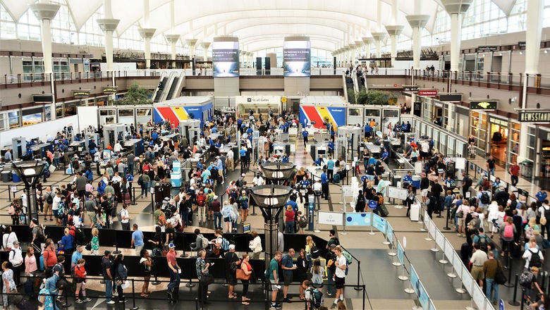 A large crowd at Denver International Airport. A large crowd at Denver International Airport.