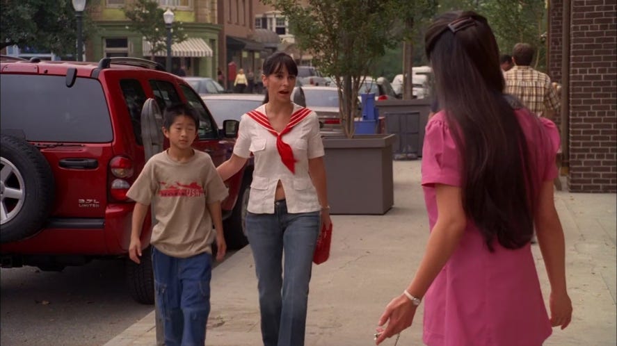 Melinda Gordon in a bizarre outfit brings a child back to his mother