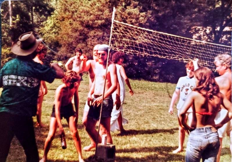 A group of people playing volleyball

AI-generated content may be incorrect.