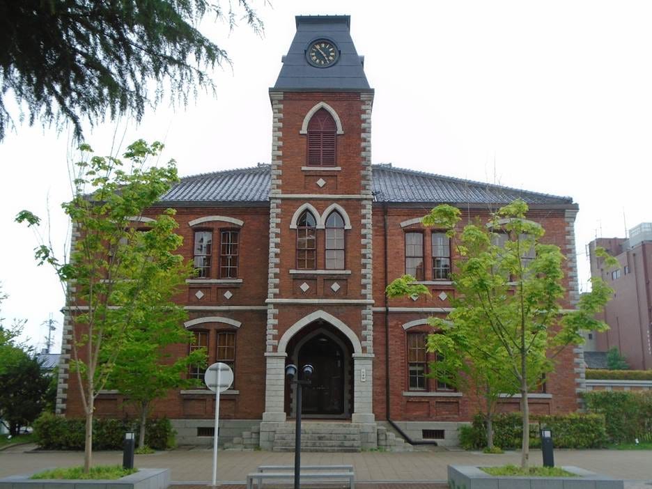 A brick building with a clock tower

AI-generated content may be incorrect.