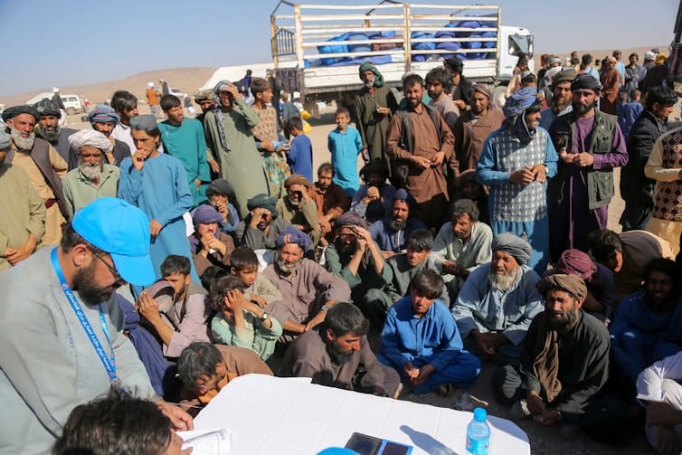 Aid distribution in a remote Afghan area after an earthquake amid ongoing humanitarian crisis
