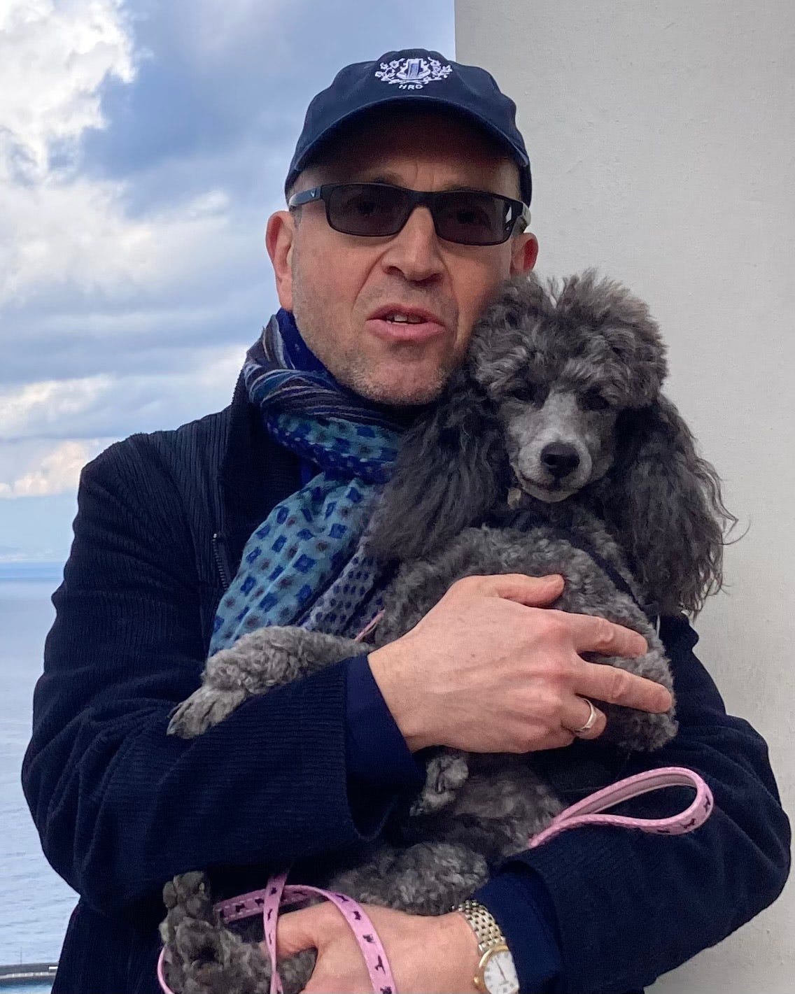 Headshot of Maxim D. Shrayer with his dog Stella